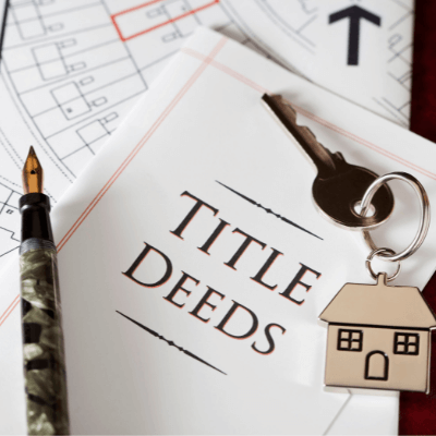 title deeds with keys to represent title and closing services